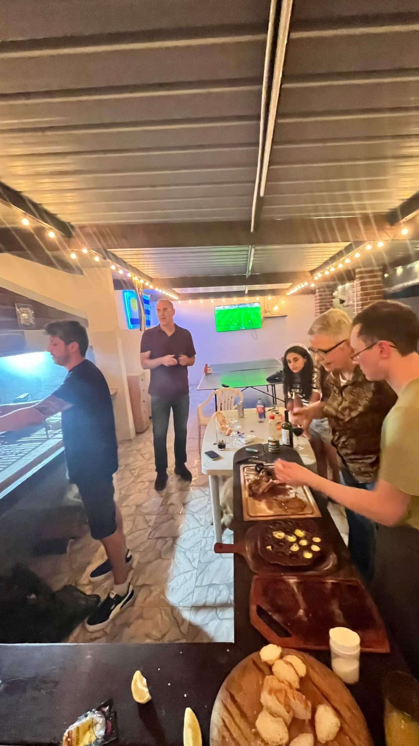 Guests sharing food and conversation at the bar